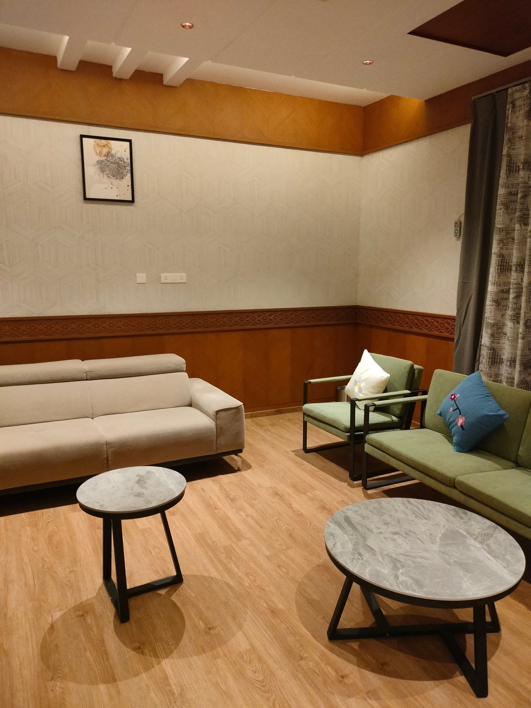 A warm, wood-panelled lounge with sofas and small tables